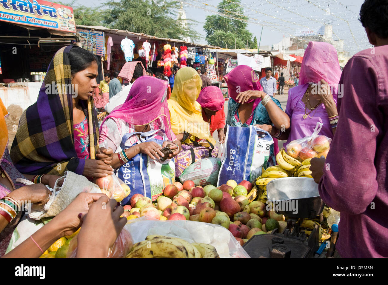 Woman buying fruits at pushkar mela, rajasthan, india, asia Stock Photo