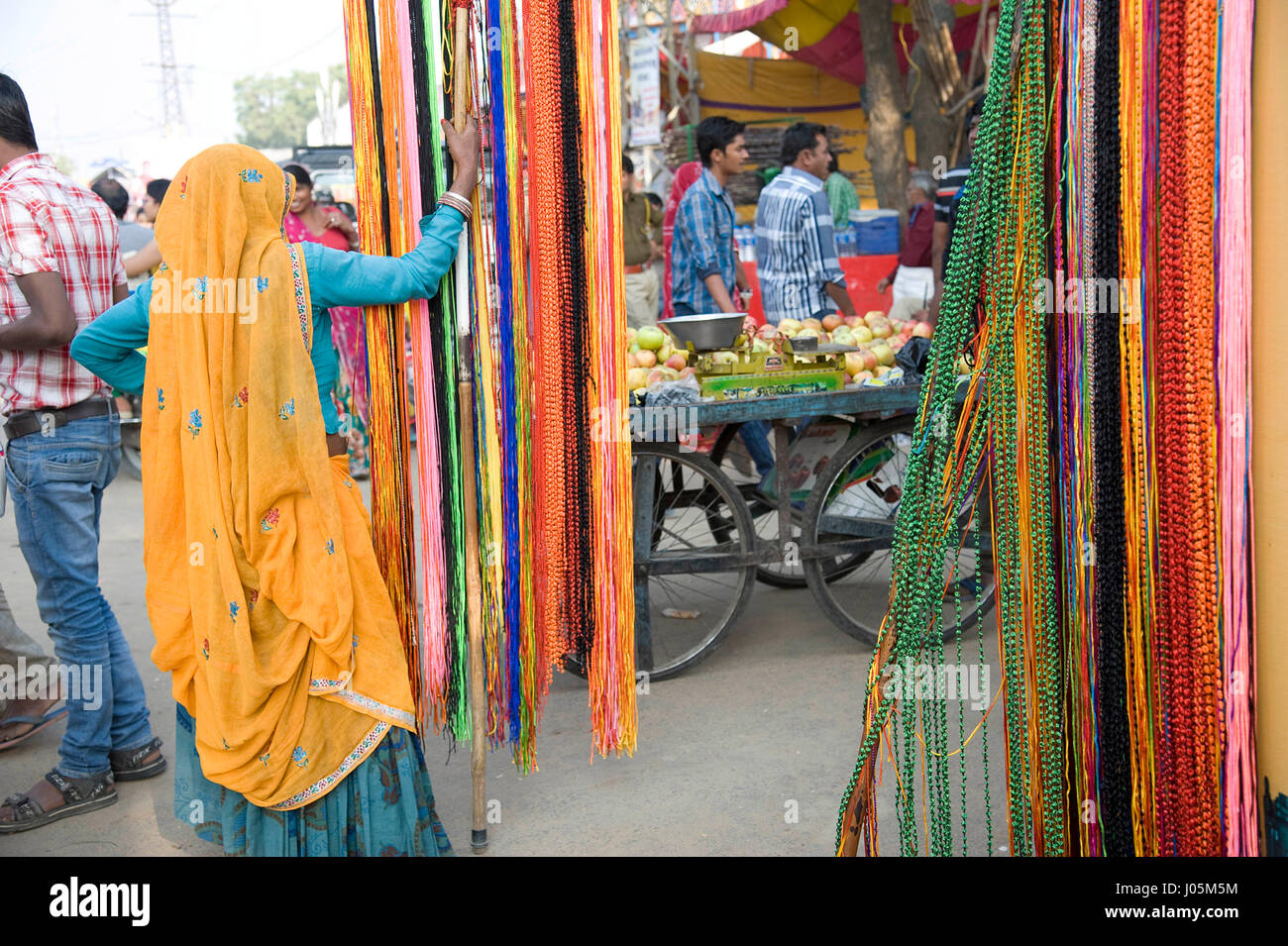 Woman selling colourful threads, pushkar fair, rajasthan, india, asia Stock Photo