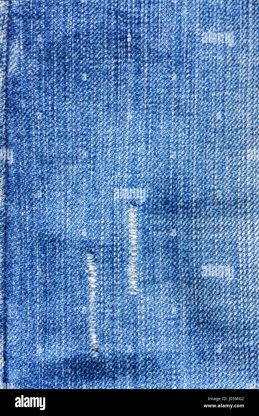 Jeans close-up, texture, torn, mopped pieces Stock Photo - Alamy