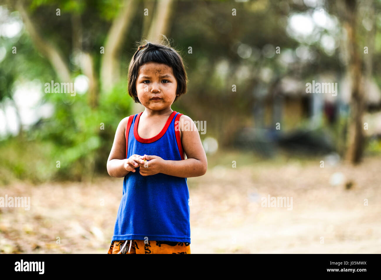Wang Dong, Thailand, March 6, 2016: Dirty little girl in a village in ...