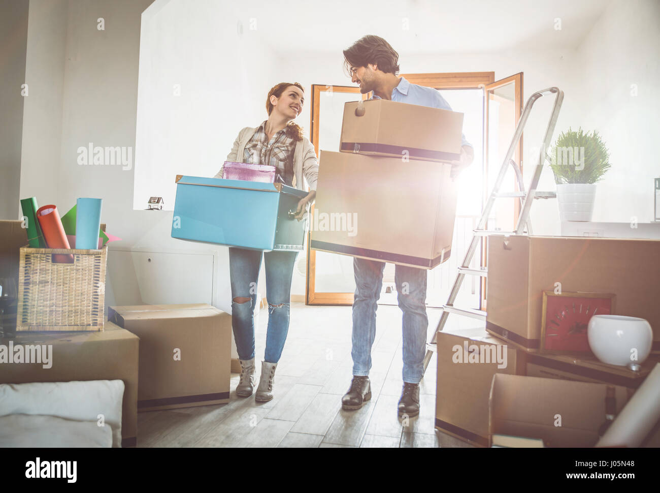 Young couple moving in into new apartment Stock Photo Alamy