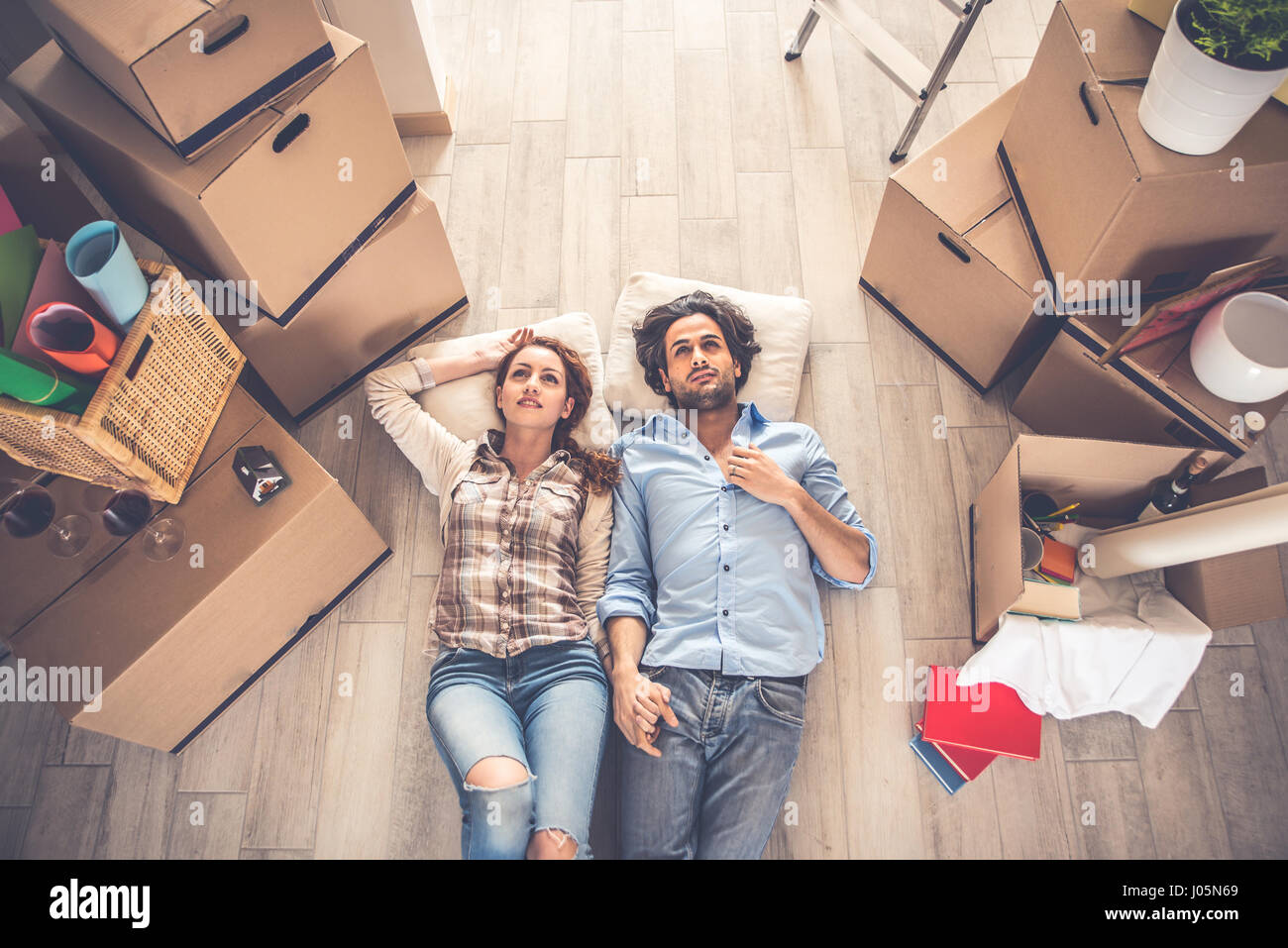 Young couple moving in into new apartment Stock Photo