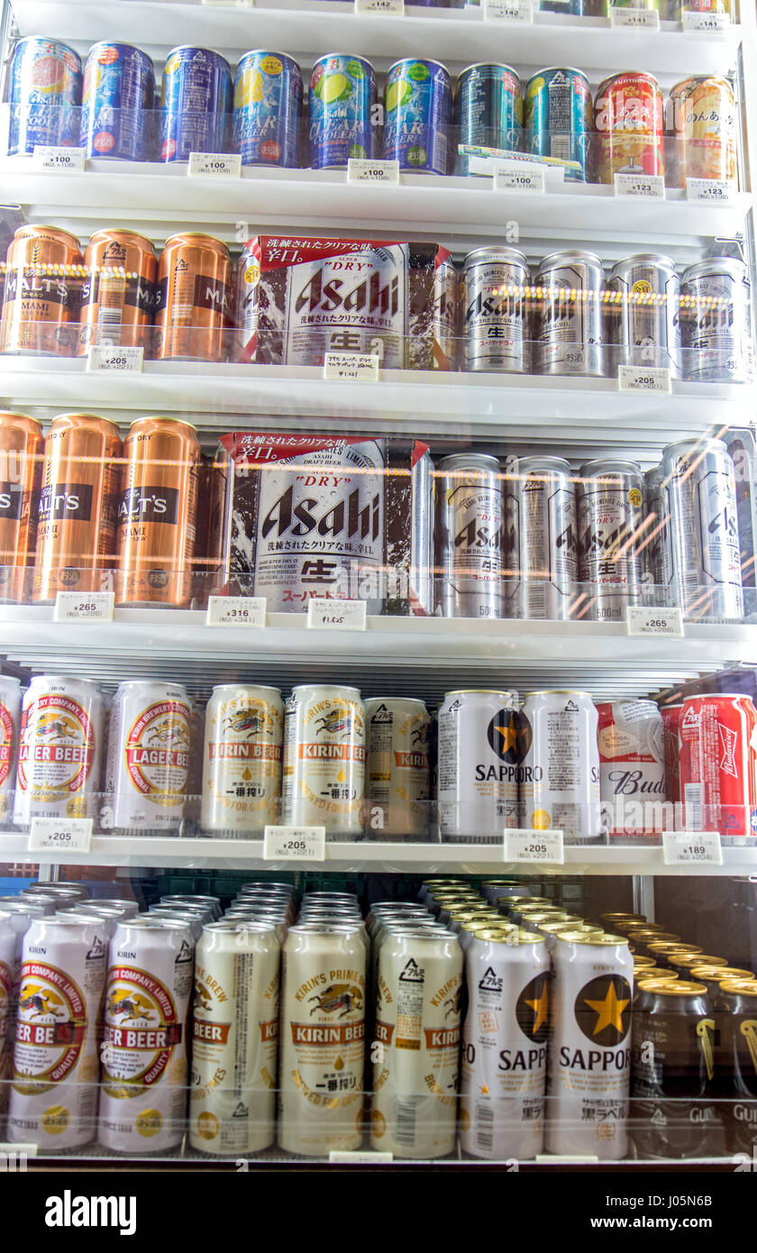 Various Beer Cans On Supermarket Shelf. Cooler full of cans of beer in the store. Variable offers of beers in refrigerator. Stock Photo