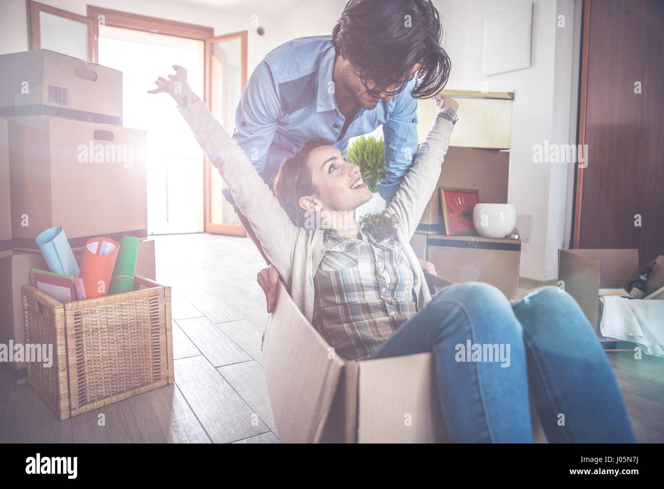 Young couple moving in into new apartment Stock Photo - Alamy