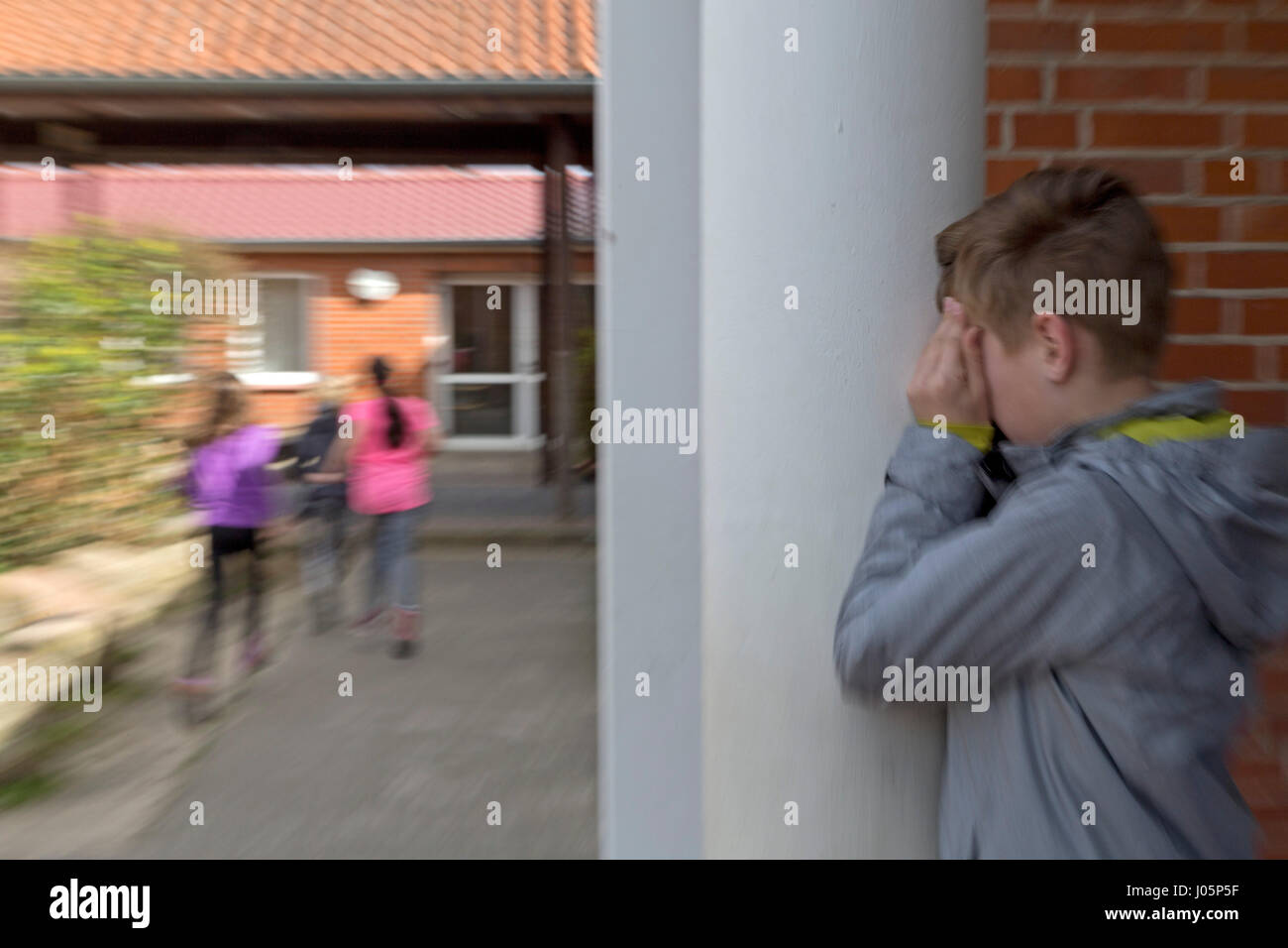 pupils at primary school playing hide and seek during break, Lower Saxony, Germany Stock Photo