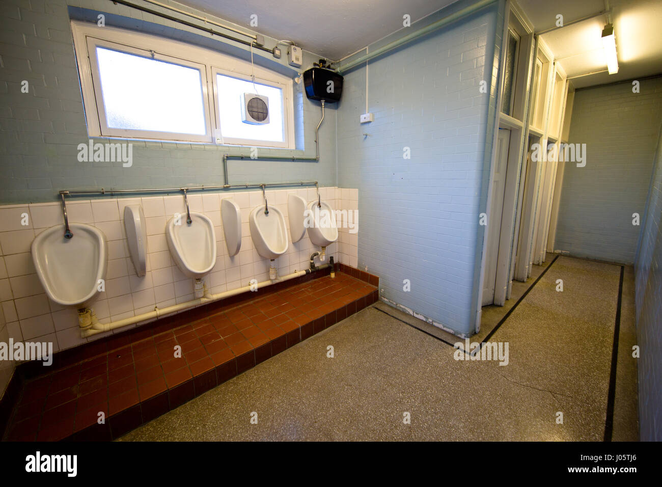 Gents toilet, row of urinals Stock Photo