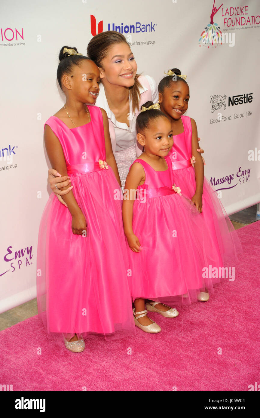 Zendaya and 3 girls in pink dresses attend the 7th Annual Women of Excellence Awards on June 13, 2015 at the Luxe Hotel in Los Angeles, CA. Stock Photo