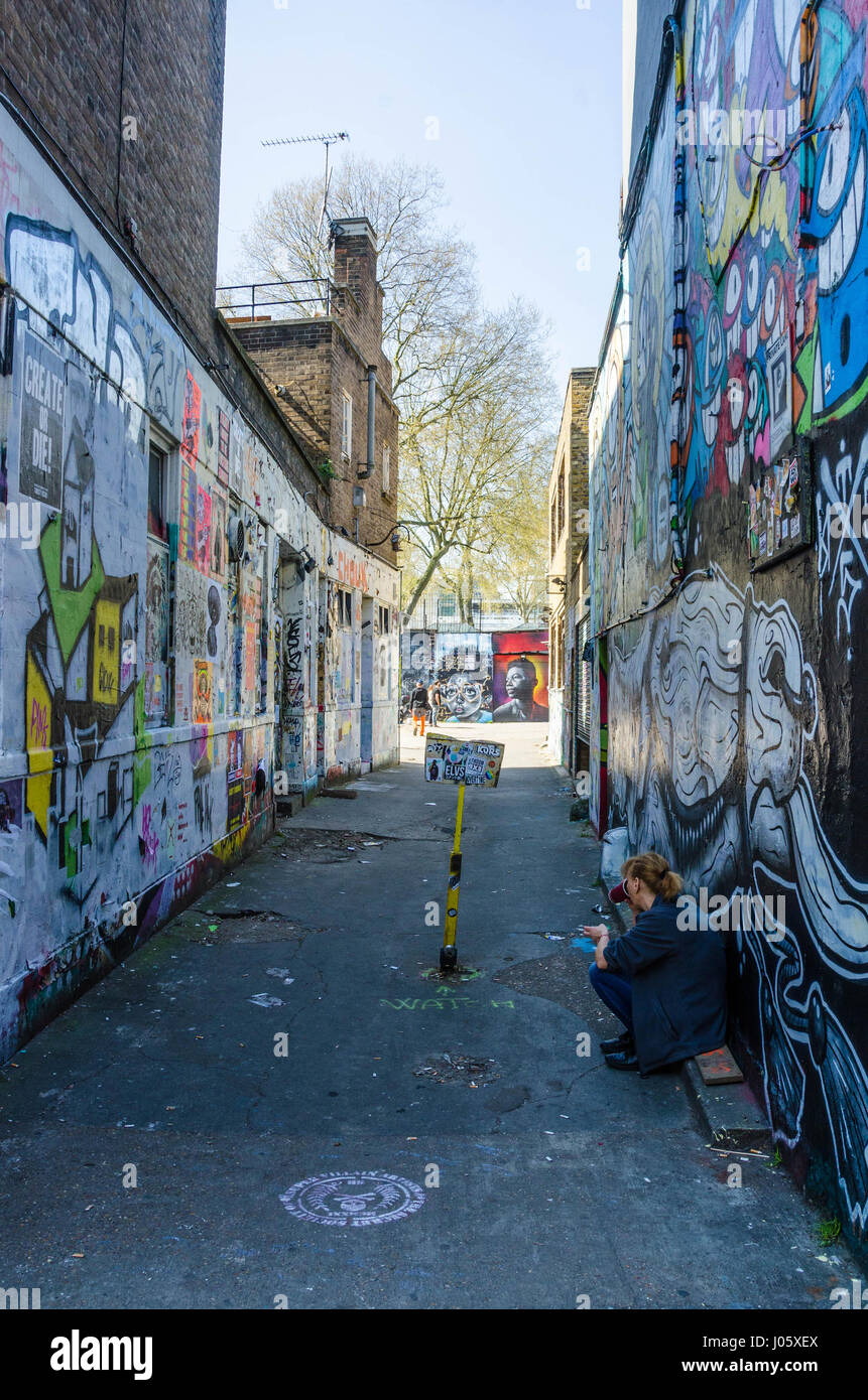 An Alleyway Leading Off Brick Lane In East London Is Covered With Street Art And Graffiti Stock Photo Alamy