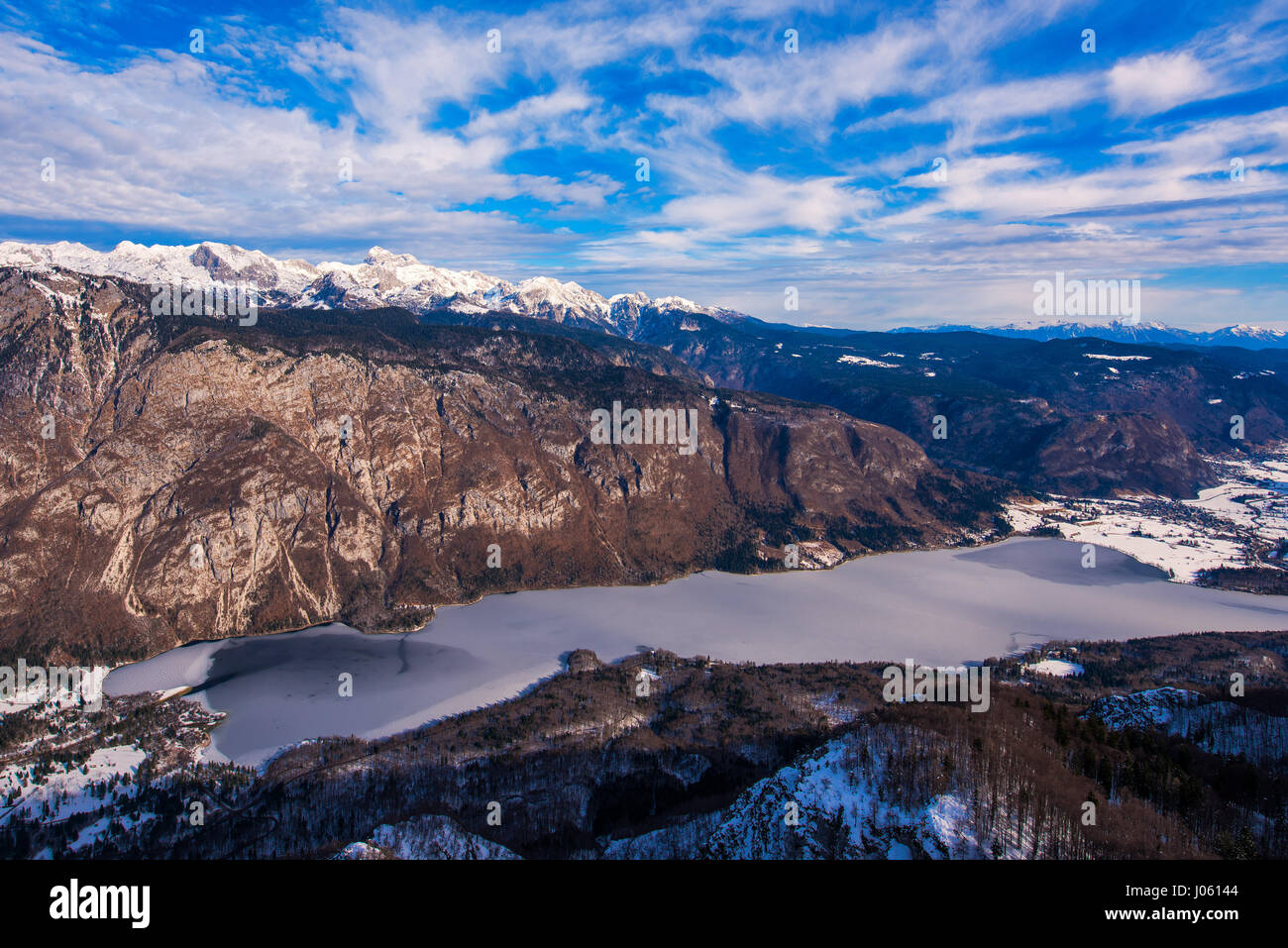 Triglav mountain above Bohinj lake valley in winter time, beautiful landscape of a part of Julian Alps mountain range and national park in Slovenia Eu Stock Photo