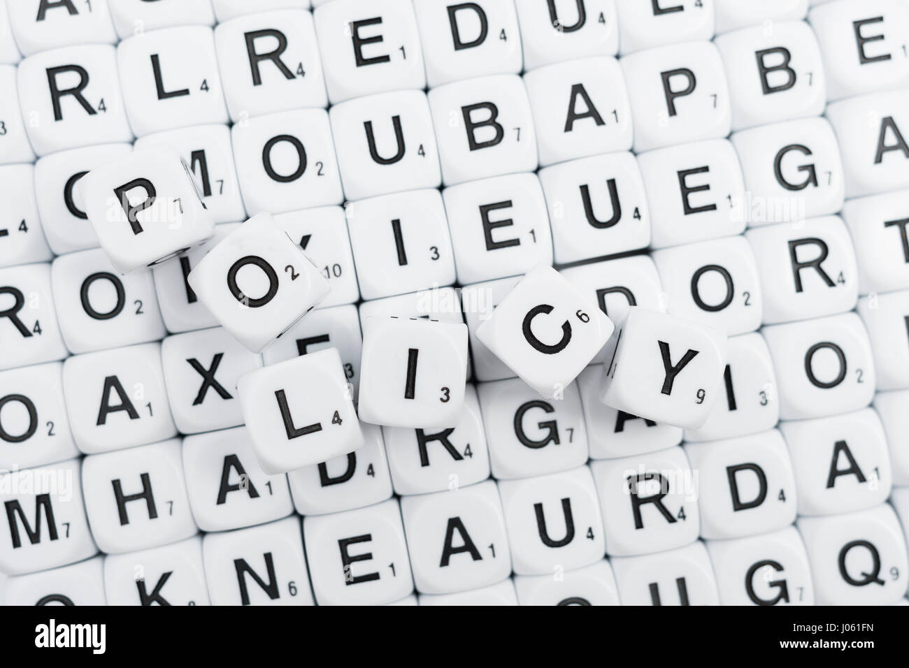 Alphabet Dice Letter Dice Scrabble Type Dice Spelling Out The Word Policy Stock Photo Alamy