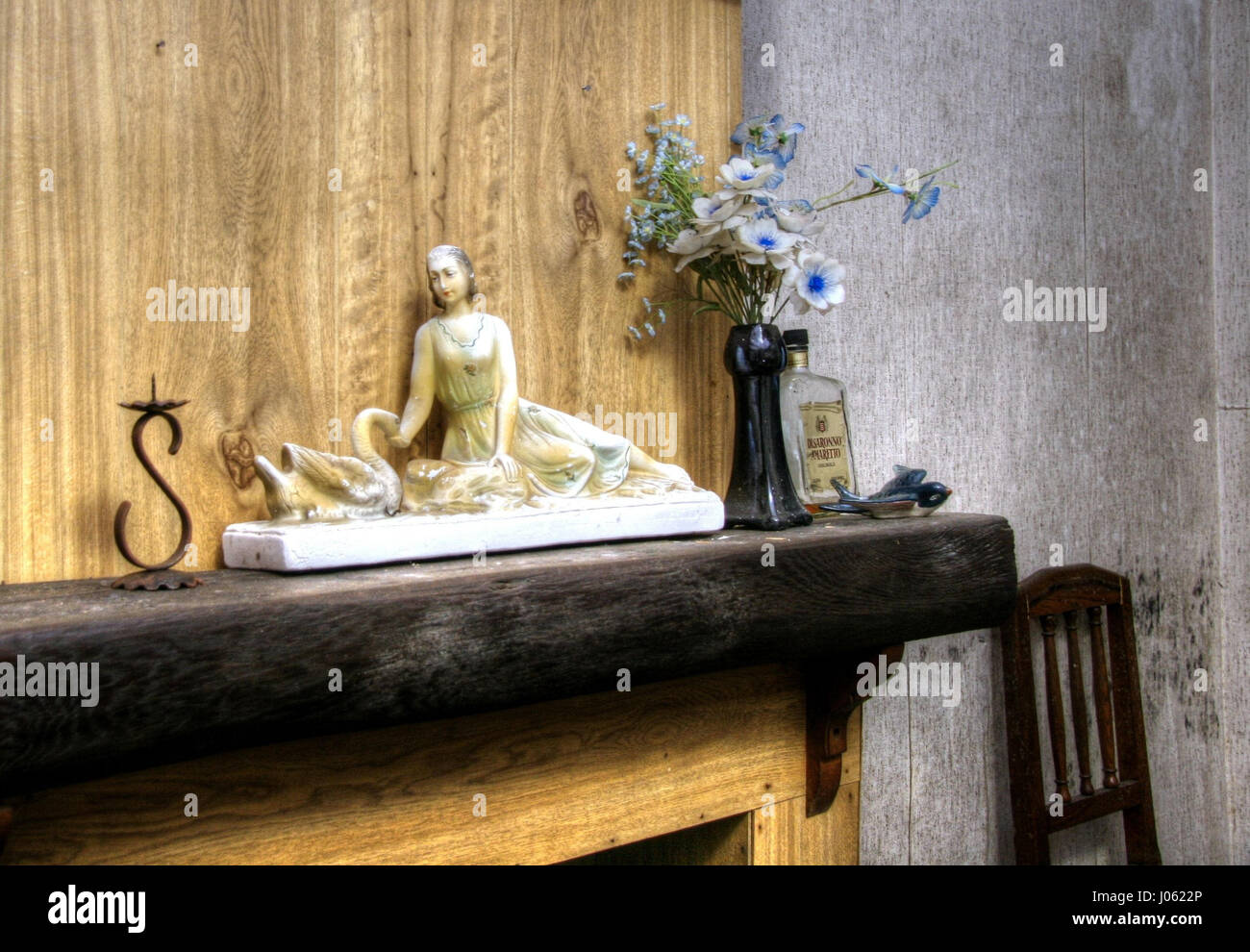 BELGIUM: FLASHBACK photos show this home where time has stood still since the 1960’s when it was mysteriously abandoned by the family who owned it. The decadent images show a decaying house with retro-wallpaper and other décor, filled with family possessions, including family portraits and a child’s yellow wellington boot. The home appears to have been abandoned in a hurry as a casserole dish and flask have been left on the dining table. Urban explorer Jane Veltmann (31) from Germany captured the lost home in Belgium using a Canon EOS 20D. Jane Veltmann / mediadrumworld.com Stock Photo