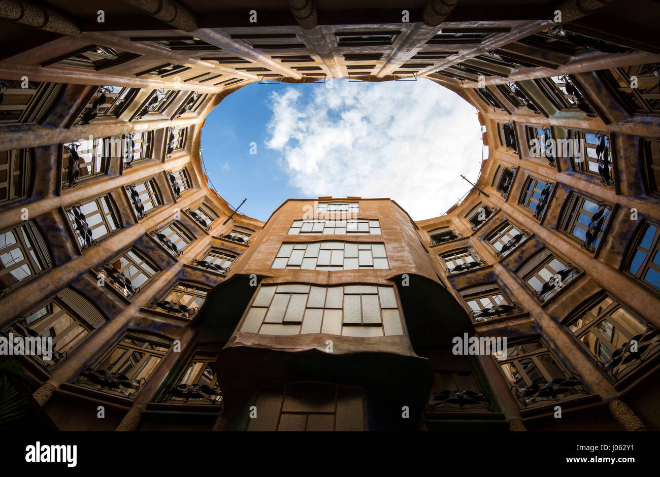 Looking up from an inner courtyard inside Casa Mila (La Pedrera) in Barcelona, Spain Europe EU Stock Photo