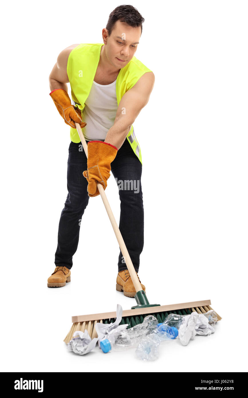 Full length portrait of a waste collector cleaning with a broom isolated on white background Stock Photo