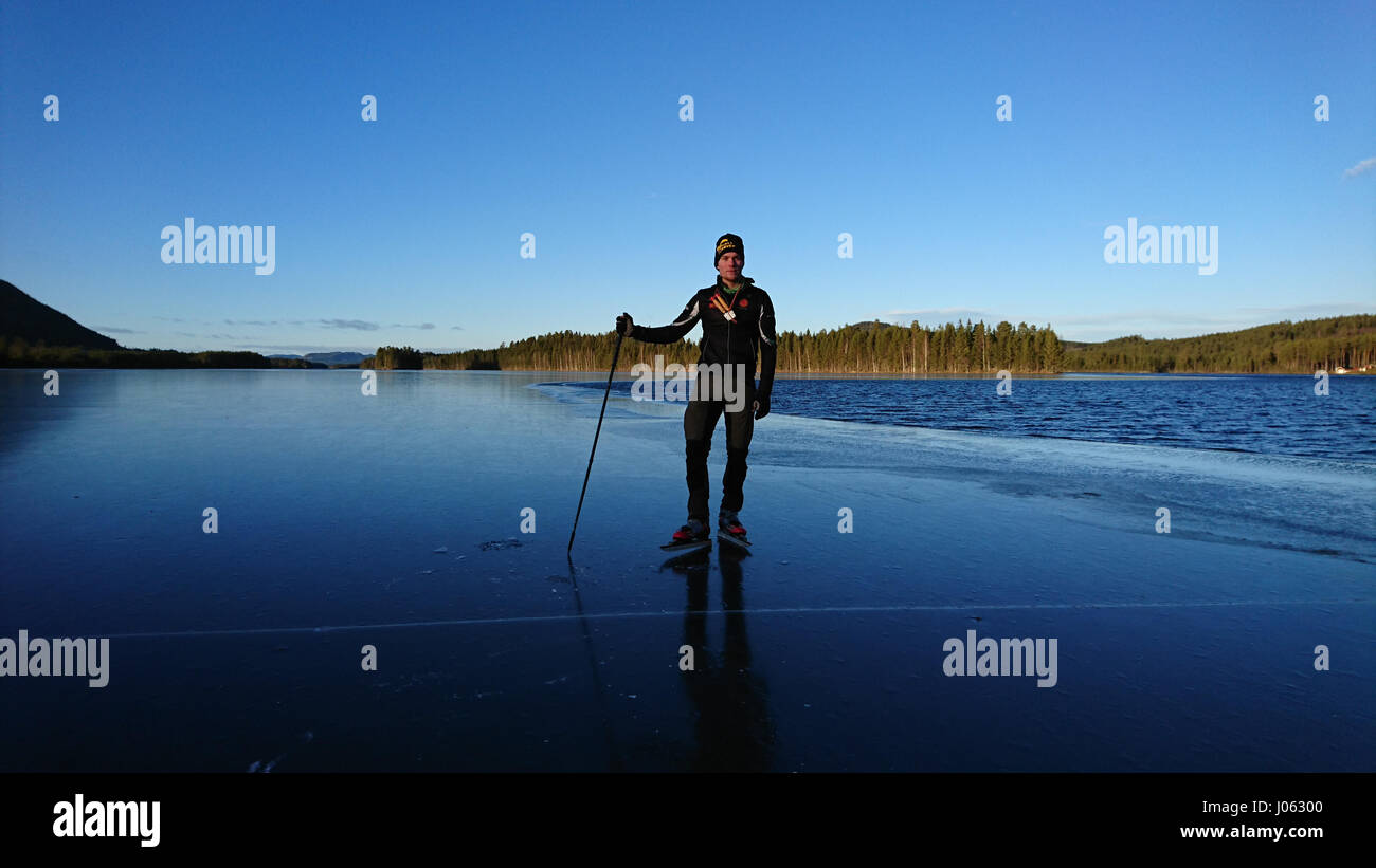 SPJUTMOSJON, SWEDEN: IS THIS daredevil brave or stupid after skating across a frozen lake where the thin layer of ice has broken up to reveal the freezing water below? Stunning footage has captured an adrenaline junkie skating and jumping between the chunks of ice without a care in the world. The video also shows the thrill-seeking skater landing on an ice floe as it begins to go under and he narrowly avoids plunging into the chilly lake. The clip was taken in Spjutmosjön, Sweden by ski shop worker Johan Eriksson (26) from Hedemora. It shows his friend Tobias Björklund enjoying himself on the  Stock Photo