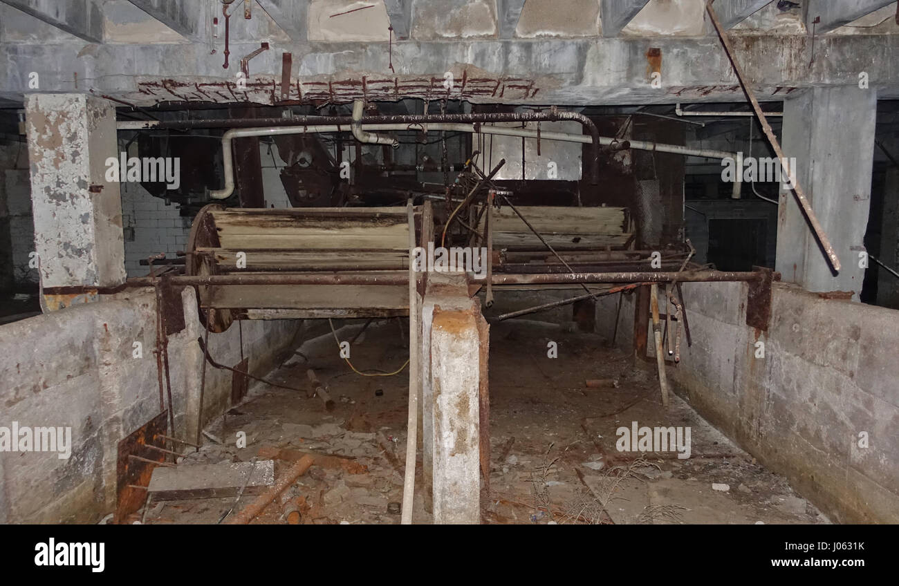 NEBRASKA, USA: EERIE images and video have revealed the abandoned remains of a long-forgotten slaughterhouse. The haunting pictures and footage show the rusting machinery left behind including vats, fans and even cutting blades while a pile of hoof bones can be seen on the killing floor. Rows of lockers still lie empty inside the building while the clocking machine looks like it may have trouble registering the start of your shift. The spooky shots were taken at an abandoned slaughterhouse in Nebraska, USA by photographer Jim Sullivan (36) from Los Angeles. Stock Photo
