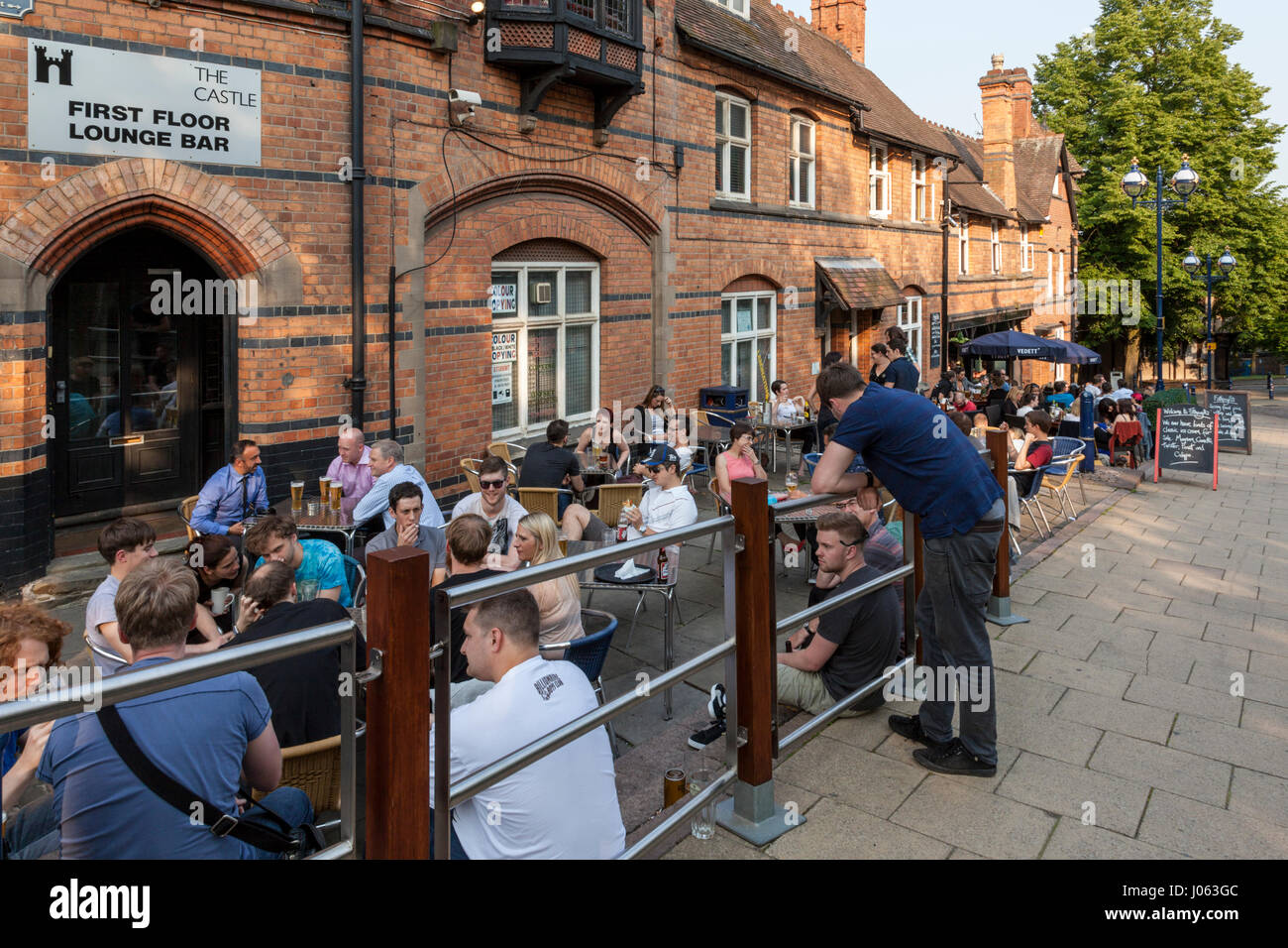 People drinking outdoors at a pub on a Summer evening, Nottingham, England, UK Stock Photo