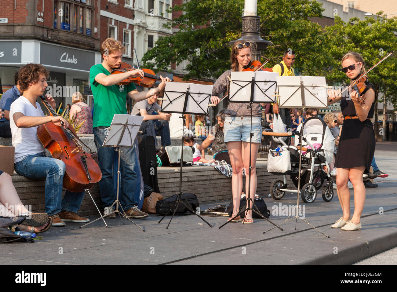 Buskers Young classical musicians busking as a classical music string