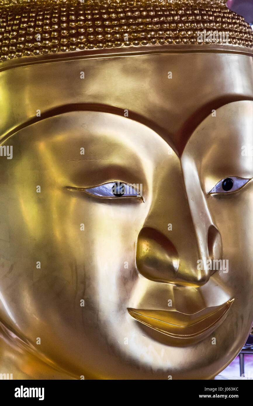 Golden Buddha face in Thai temple Stock Photo