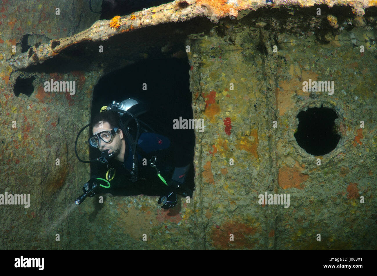 One diver explores the wreckage. EERIE underwater pictures show inside the wreckage of the sunken British World War Two ship SS Thistlegorm on the seventy-fifth anniversary of her sinking. The series of images show the rusted remains of the merchant navy ship’s cargo which includes motorbikes, army trucks and an aircraft propeller. Other pictures show how sea life have been inhabiting the wreckage. Stock Photo