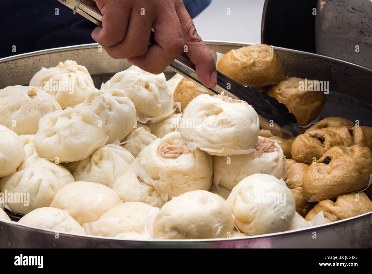 Chinese steamed pork buns on a street food stall in CHinatown, Bangkok Stock Photo
