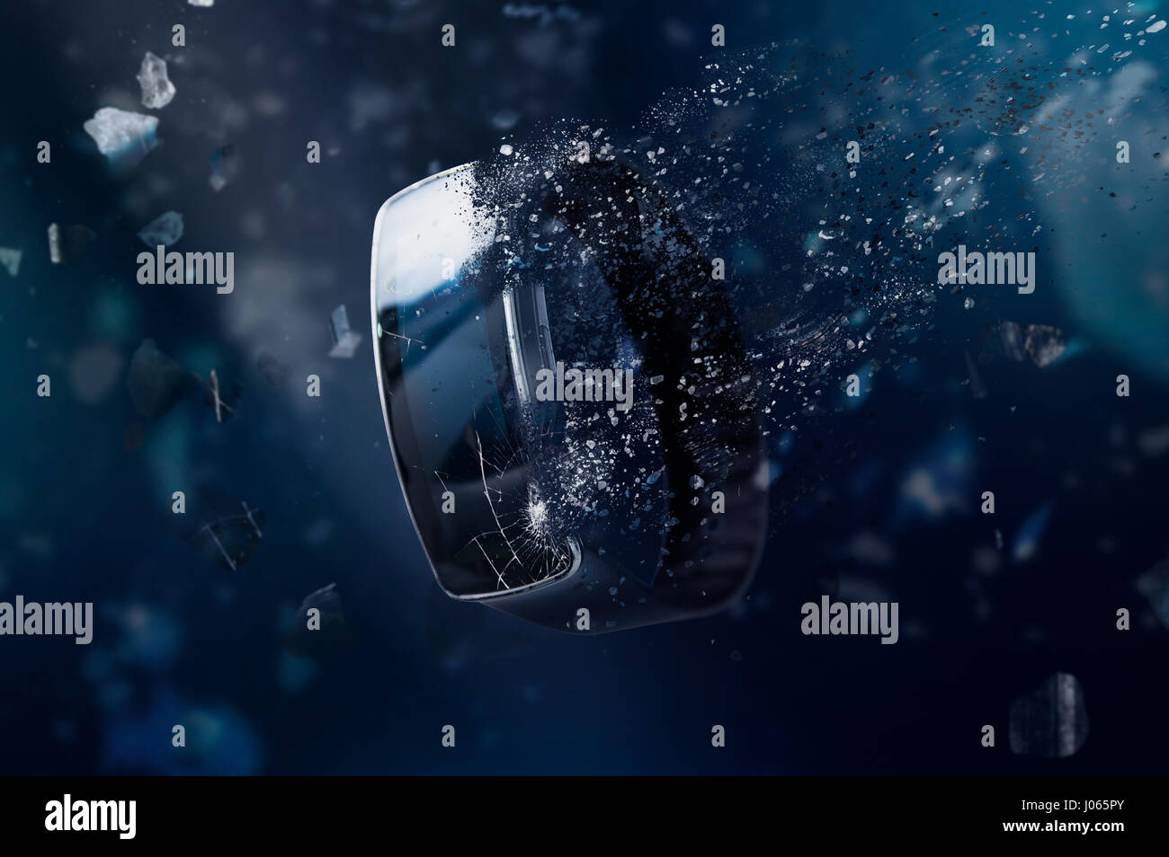 The smartwatch is disintegrating in space. Conception of passage of time and obsolete technology Stock Photo
