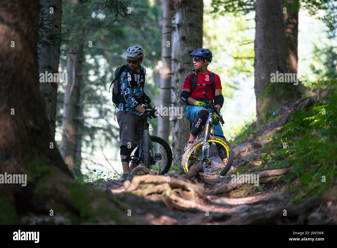 Two mountain bikers having a rest in the Kaprun region, Austria. Stock Photo