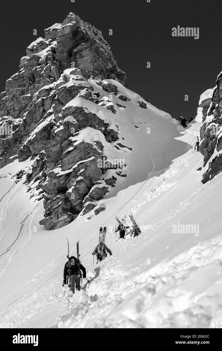 Skiers fight their way up a mountain in the Sportgastein ski region, Austria. Stock Photo