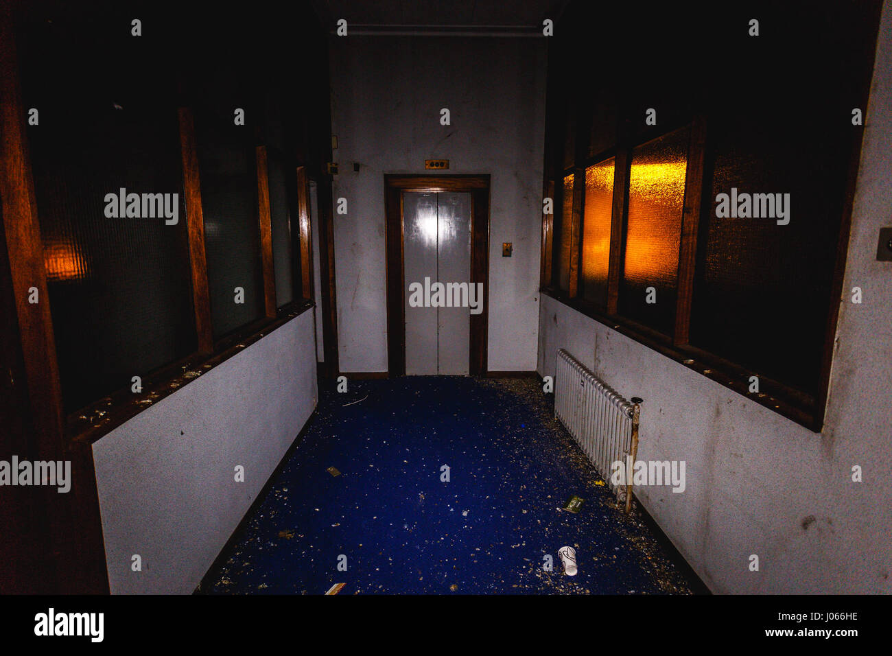 BELFAST, UK: EERIE images have revealed the rotting remains of a once-thriving bank in the heart of a British high street where an Irish rebel leader was once sentenced to death. The unsettling snaps show the bank’s ten-foot high vault as well as rows of safety deposit boxes and one man rifling through them. Other pictures show posters from the early 20th Century championing women’s rights to vote and a Guy Fawkes mask left hanging and dusty log books, all left behind since the place was abandoned in 2000. The stunning shots were taken at an abandoned Northern Bank in Belfast city centre by ph Stock Photo