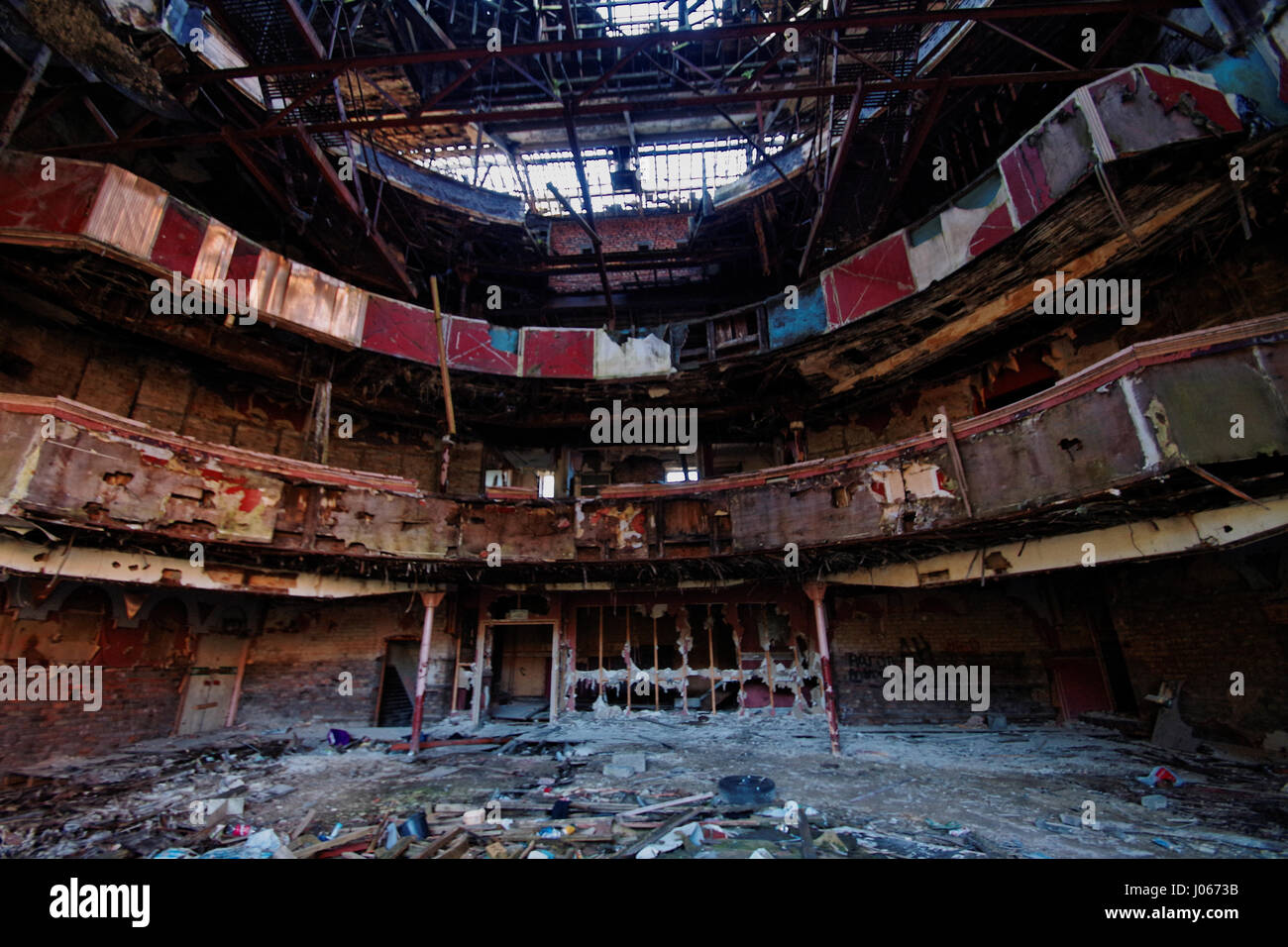MANCHESTER, UK: SHOCKING pictures show the crumbling interior of a once great British theatre which now provides basic shelter to some of Manchester’s homeless. Pictures show the redbrick frontage of the imposing building which had the capacity to hold up to two and half thousand visitors as its original incarnation as a theatre, as well as the dilapidated interior which has clearly been left to rot.  British Builder James Cole (40) from Skipton was curious enough to venture inside this once grand setting to capture what remains of the Crown Theatre, also known as the Lyceum at Eccles, Manches Stock Photo