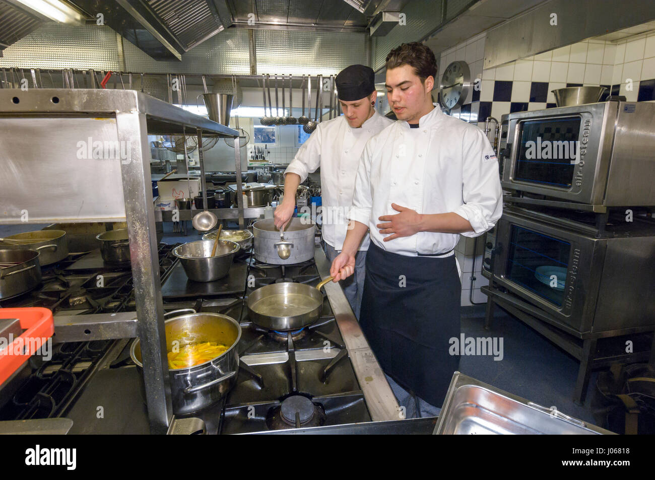Students in a restaurant school learn to cook, Sweden. Stock Photo