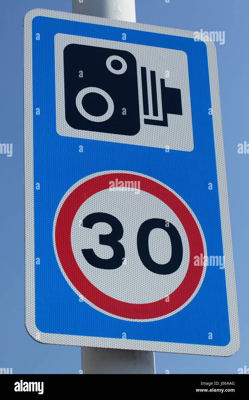 Combined 30 mph speed limit and traffic enforcement camera sign UK Stock Photo