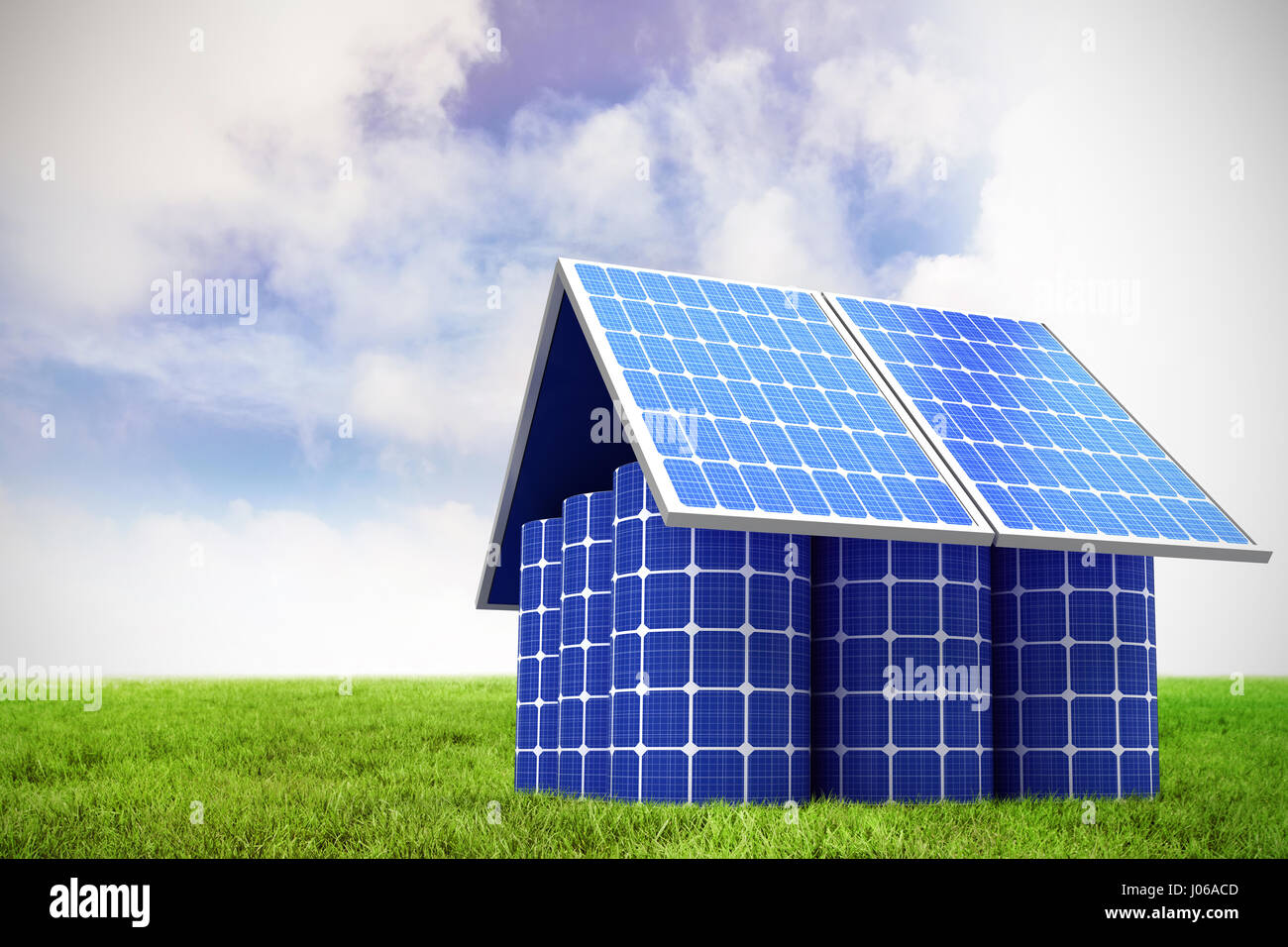 3d image of model home made from solar panels and cells against blue sky over green field Stock Photo