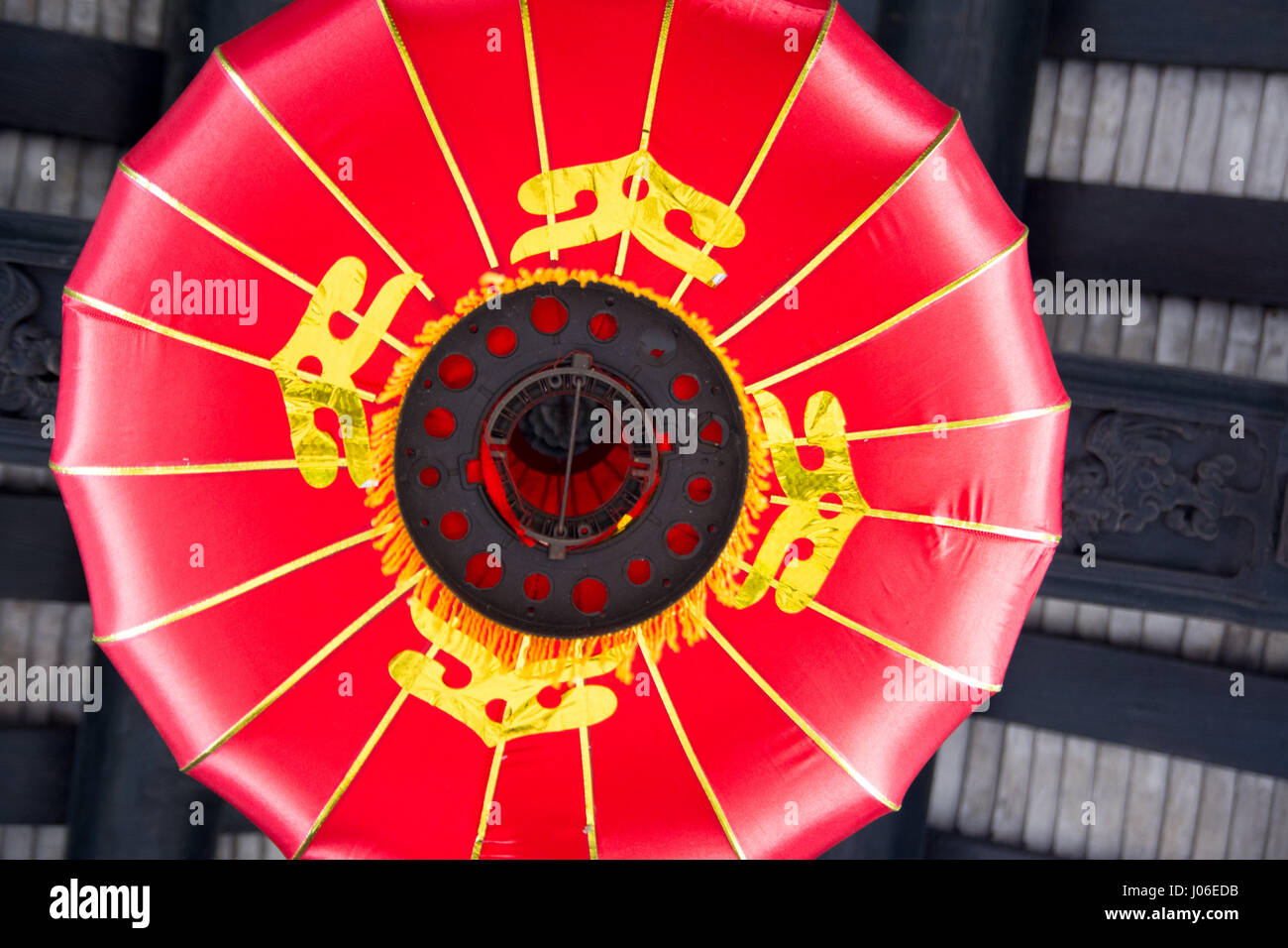 Red Chinese lantern hanging from the ceiling close up Stock Photo - Alamy