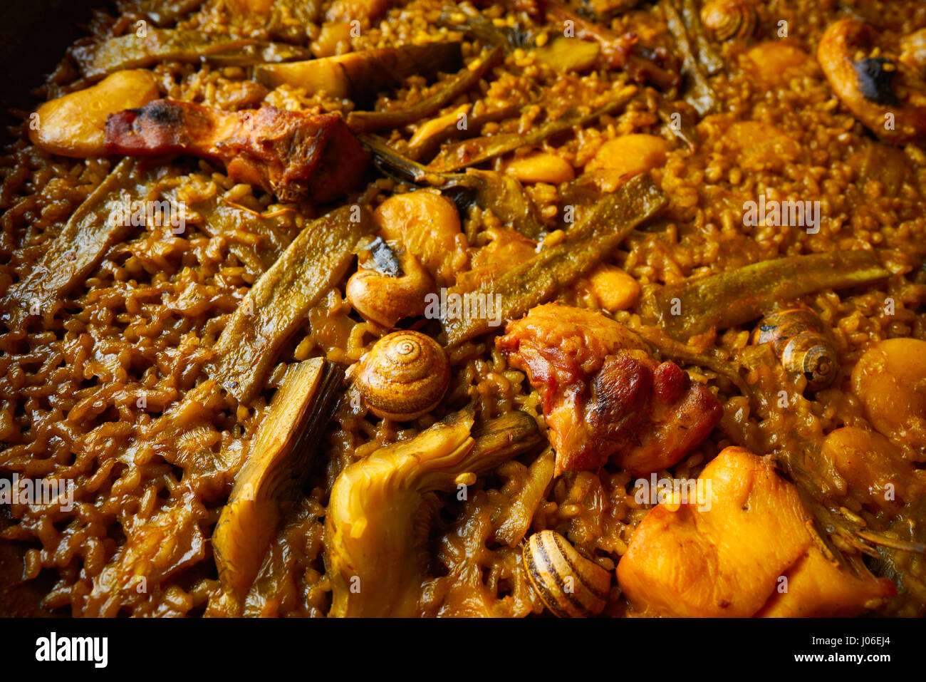 Valencian Paella with chicken rabbit artichokes beans and snails Stock