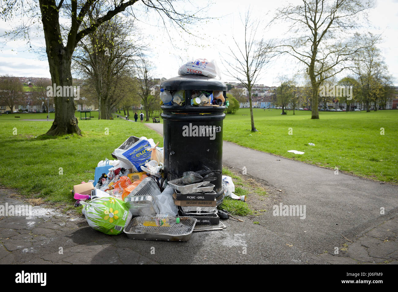 Rubbish and litter surrounds a bin at Victoria Park in Bedminster