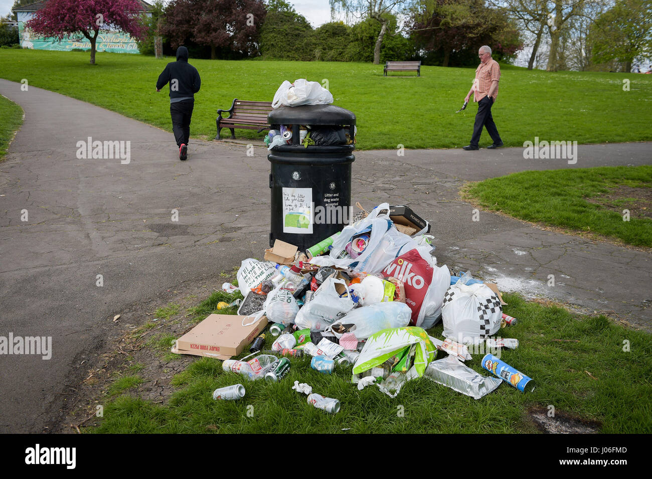 Dropping litter in a bin hires stock photography and images Alamy