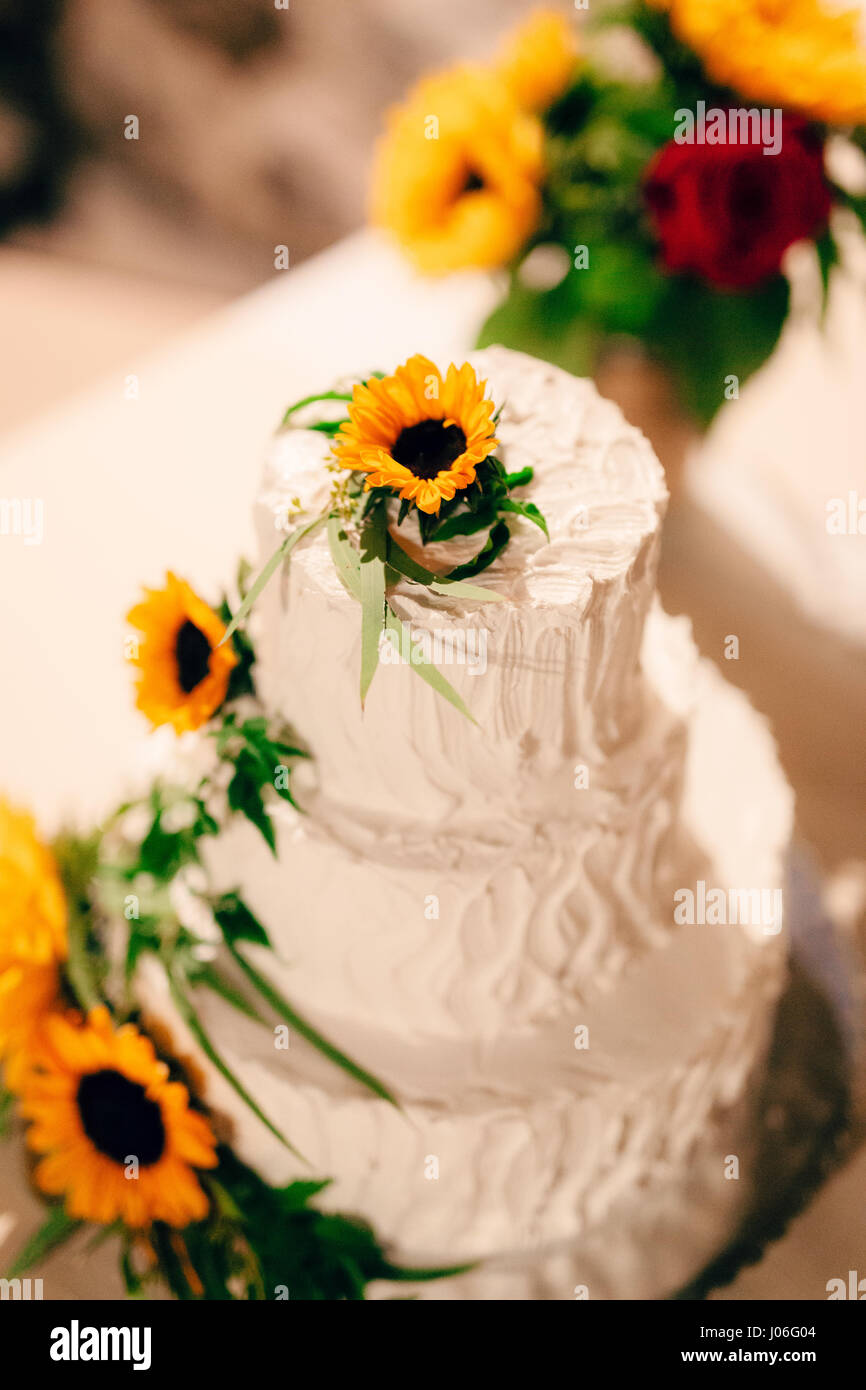 Wedding Cake Decorated With Flowers Of Sunflower Stock Photo