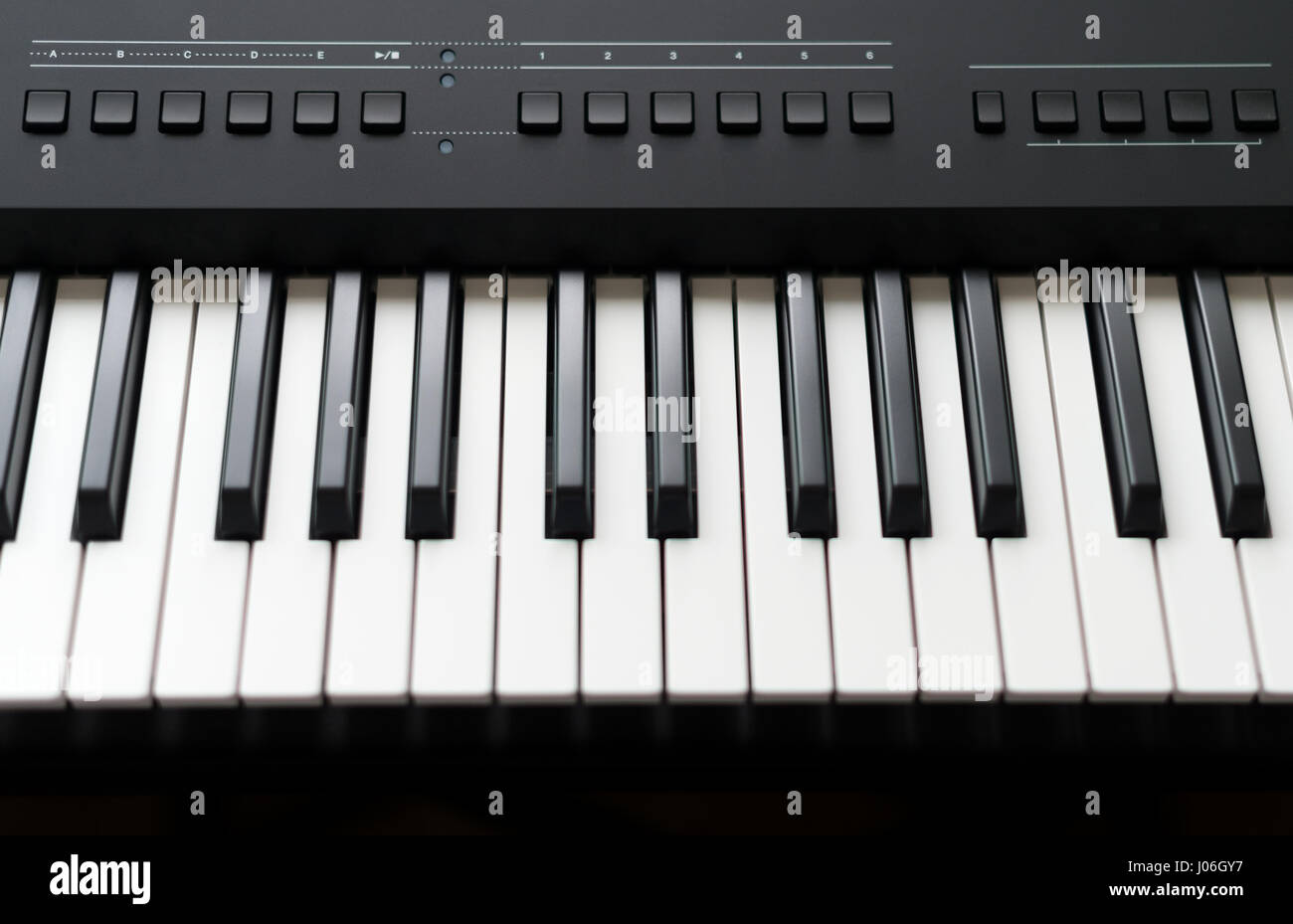 Professional midi keyboard synthesizer with knobs and controllers. Stock Photo