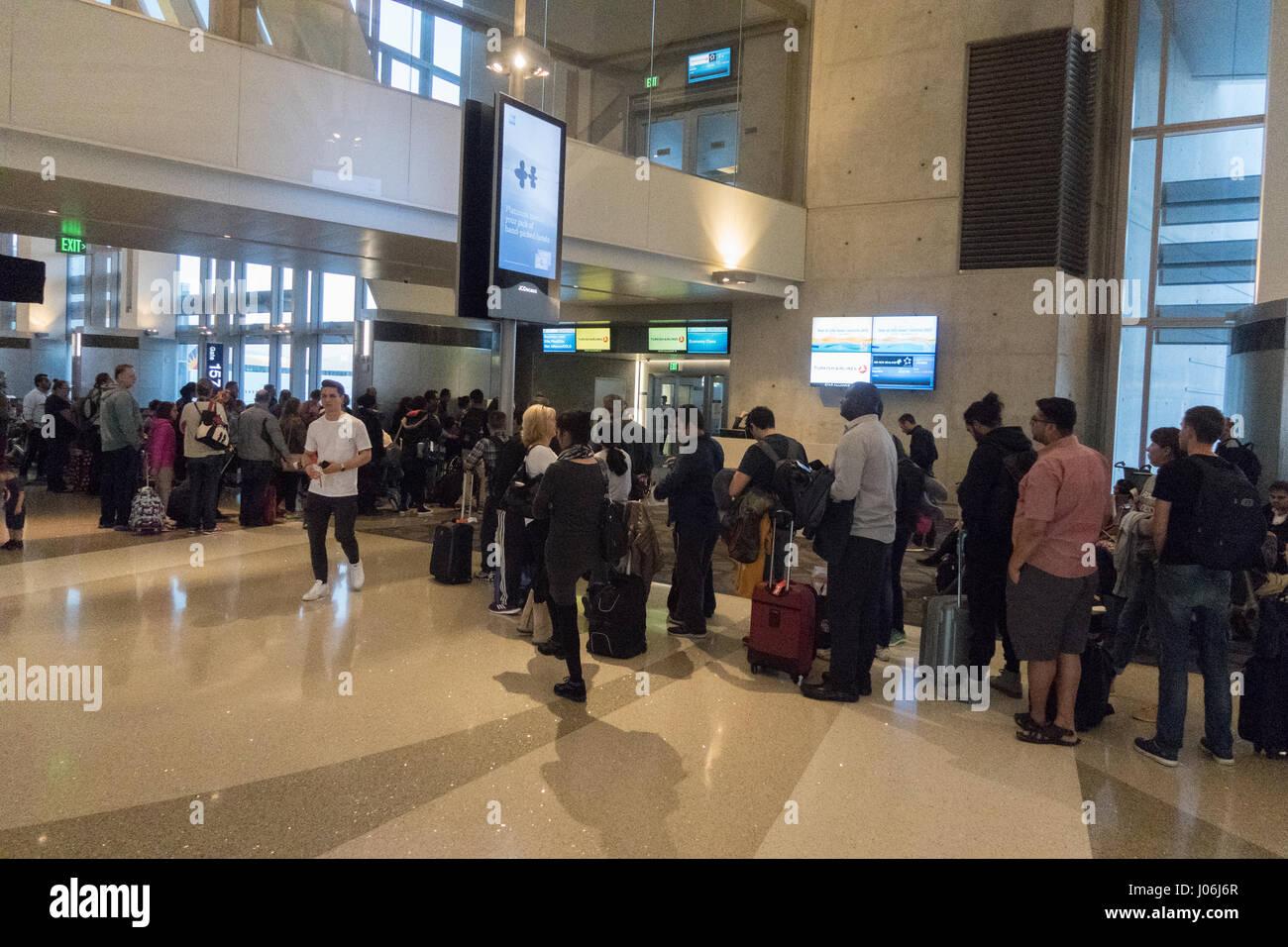 Passengers waiting at an airport boarding gate Stock Photo Alamy
