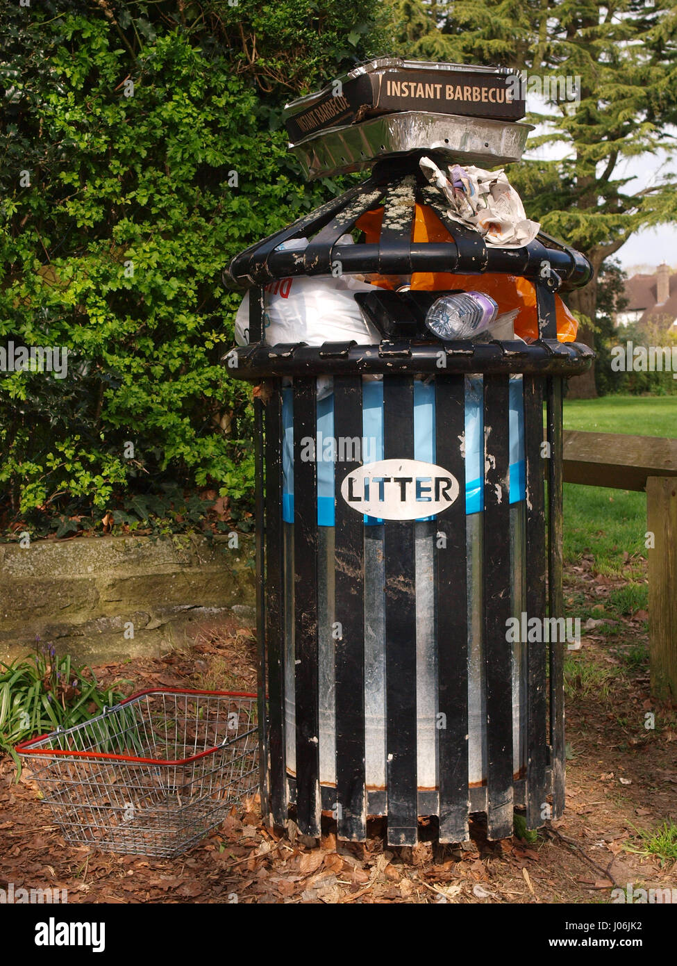 Litter bin full of rubbish Stock Photo