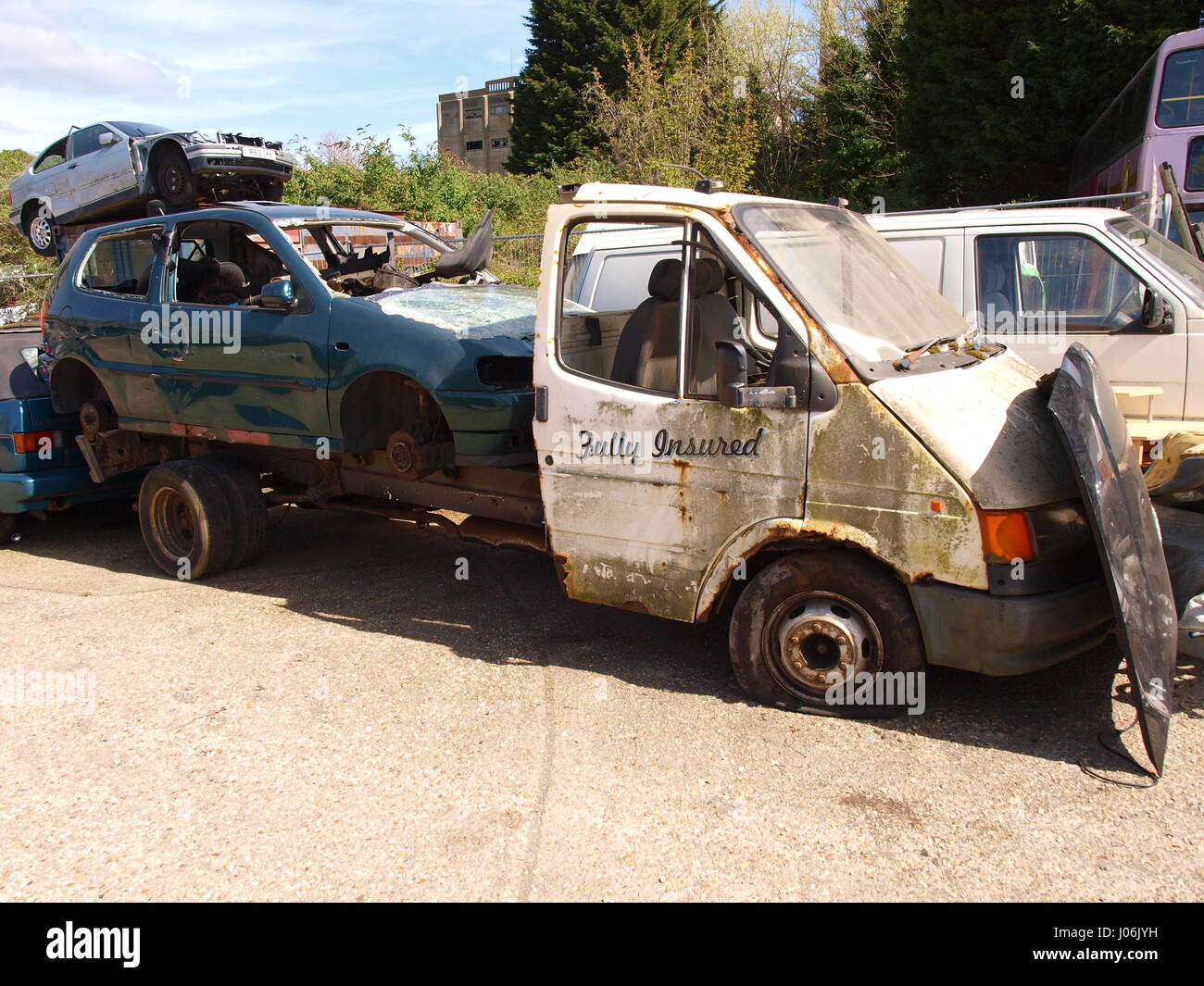Broken down truck carrying ca Stock Photo