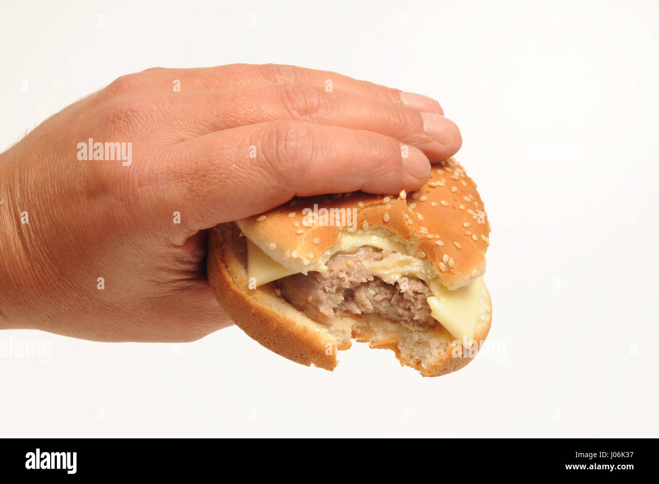Hand holding Hamburger isolated on white Stock Photo