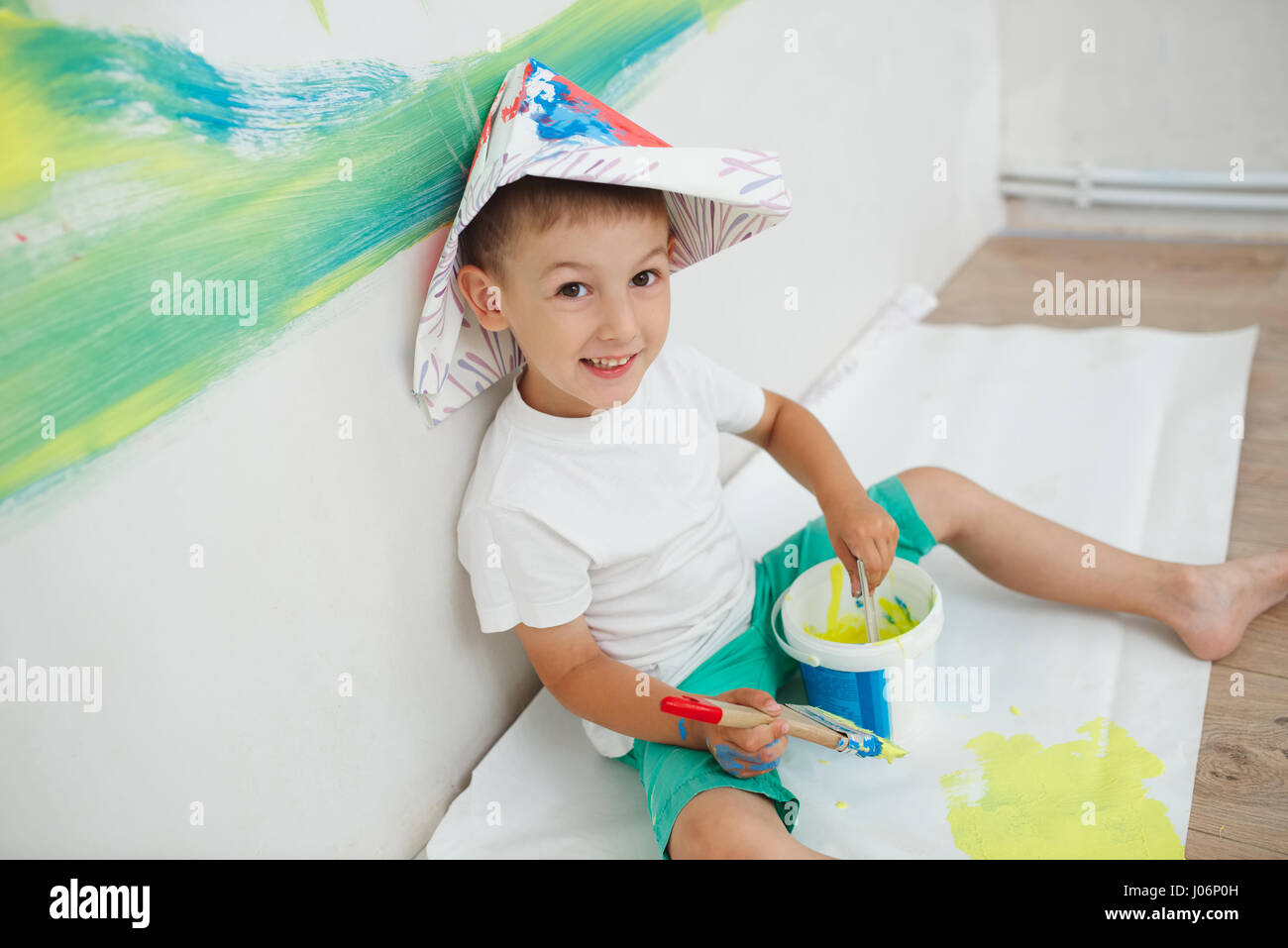 little happy boy with colorful brush Stock Photo - Alamy