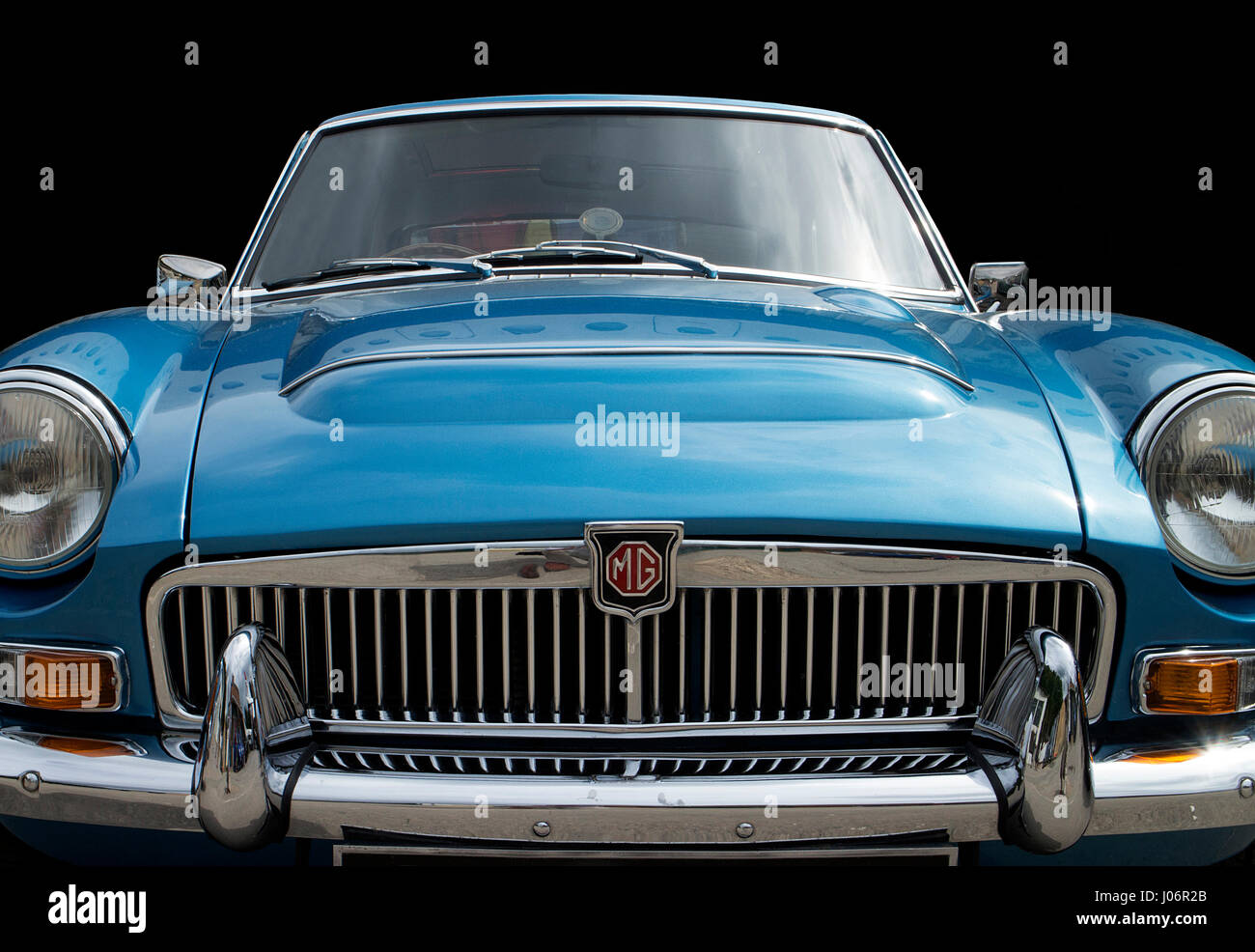 Close-up of chrome radiator grill and front of an MGC classic car Stock ...