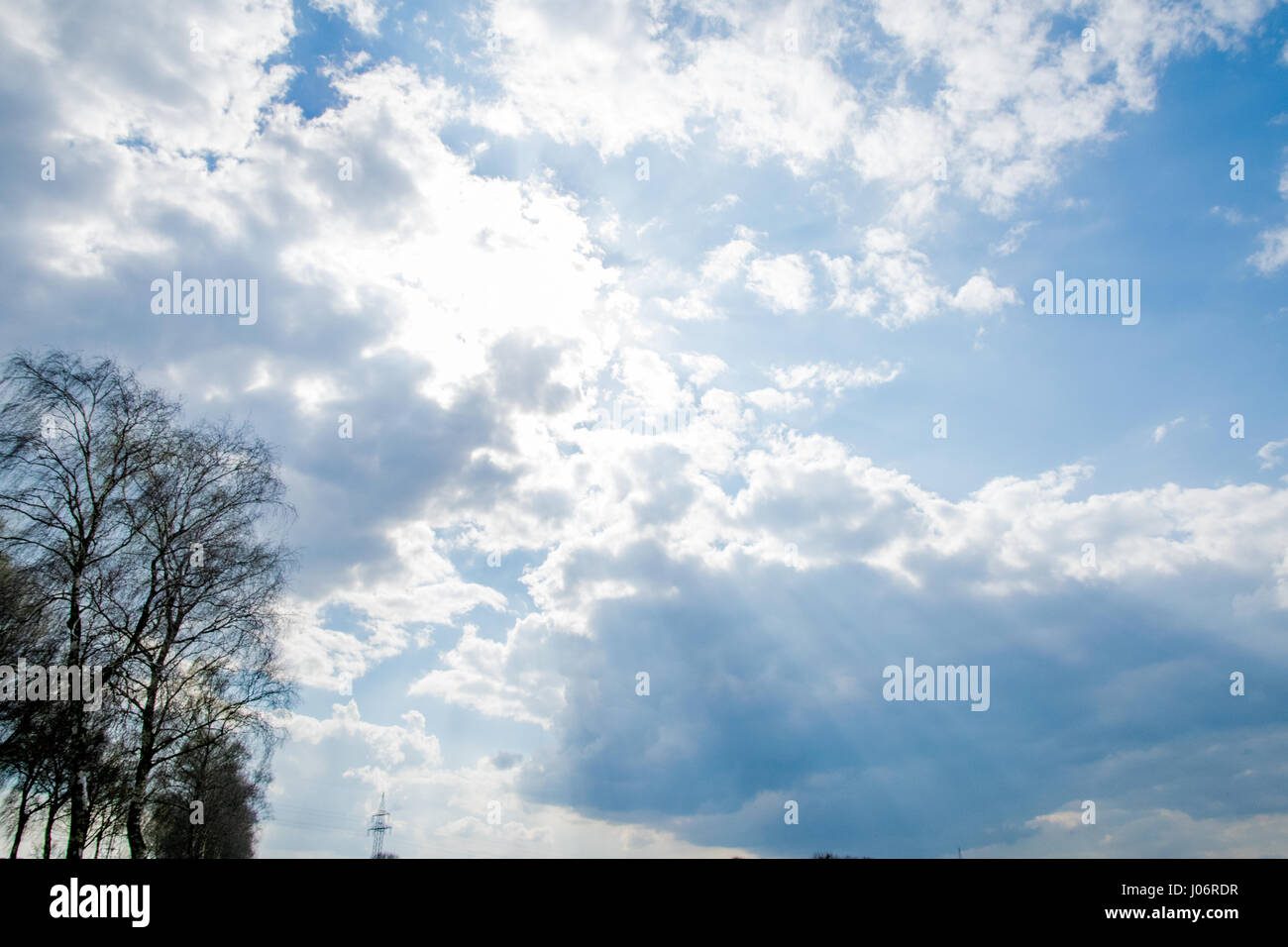 beautiful blue sky with clouds and sun rays Stock Photo - Alamy