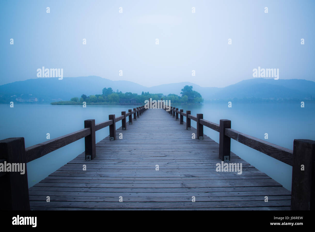 Chinese bridge and pavillon by the lake in daybreak NanBei Lake Zhejiang China Stock Photo