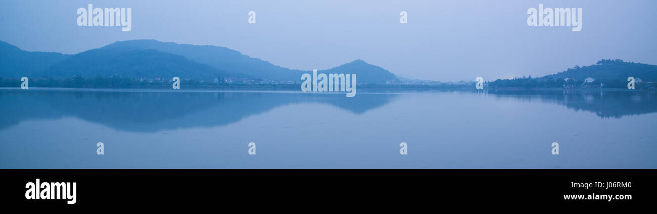 Chinese bridge and pavillon by the lake in daybreak NanBei Lake Zhejiang China Stock Photo