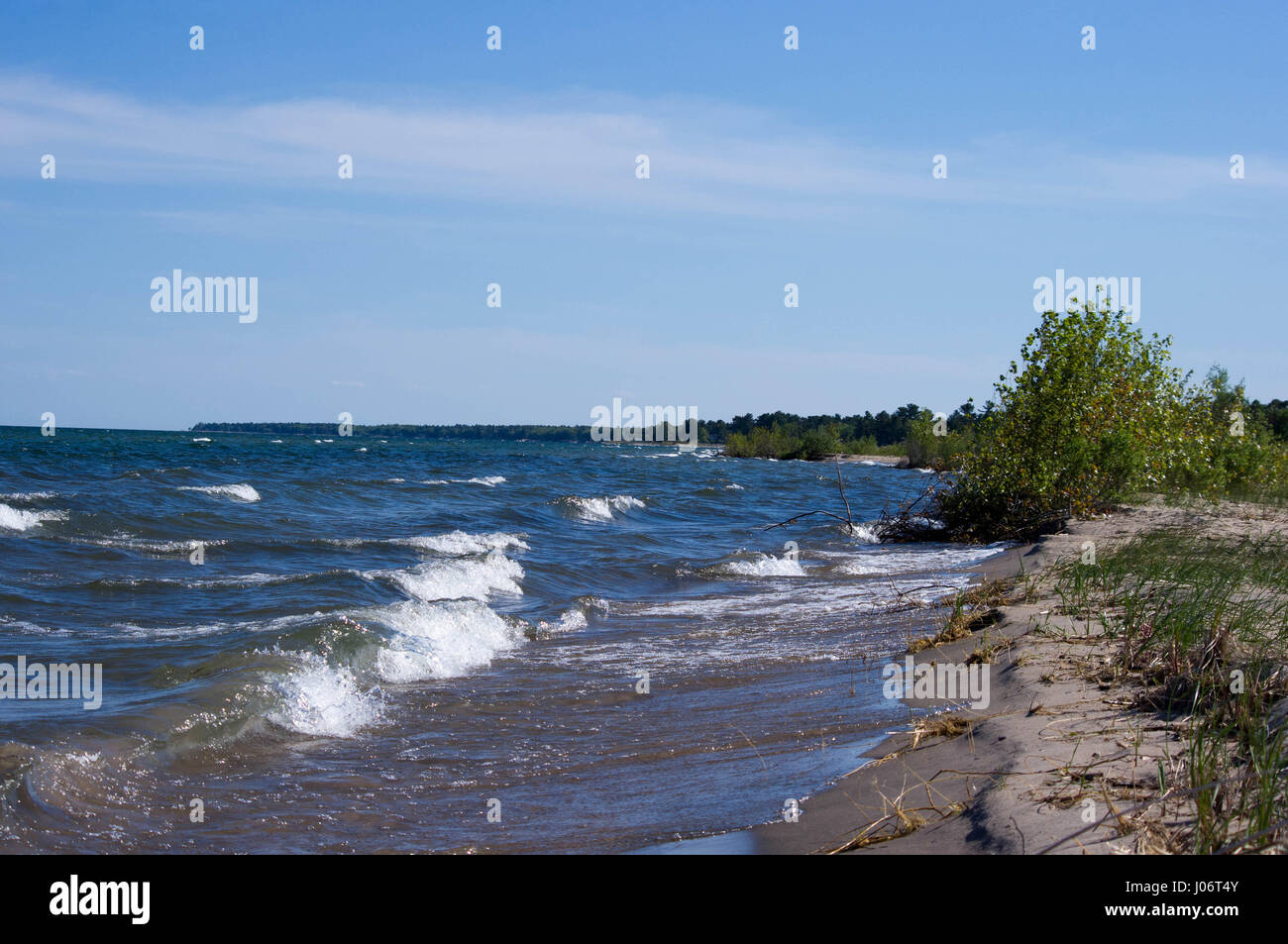 Lake Huron shoreline sandy beach with large waves. Stock Photo