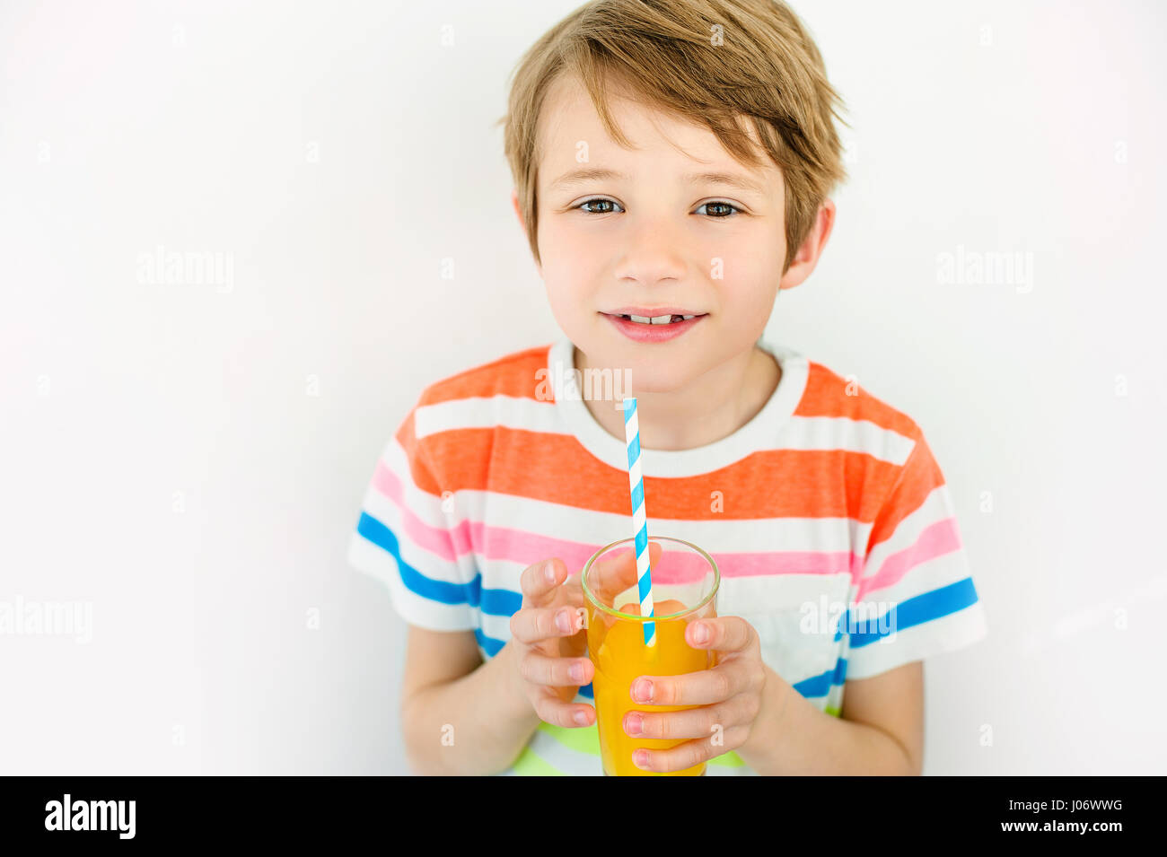 Little boy drinking orange juice hires stock photography and images