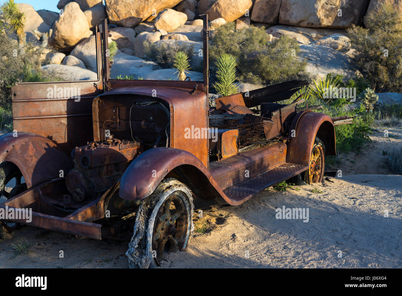 Rusted and abandoned car in the desert. Joshua Tree National Park